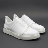 White sneakers on a dark gray background